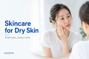 Woman checking dry skin before her skincare routine in a bright bathroom mirror