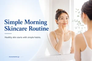 Featured image for a simple morning skincare routine guide, featuring a woman applying skincare in front of a bathroom mirror in a clean, bright setting.